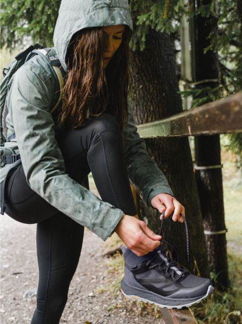Woman tying up her shoelace